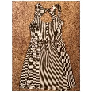 White and gray striped dress with open back.